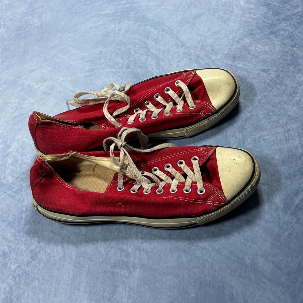 Red Converse All Star low top trainers.